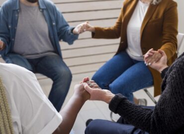 close-up-community-holding-hands